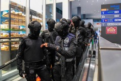 Special Task Force on Organised Crime personnel at the arrival hall in klia2 today. - The Malaysian Insight pic by Seth Akmal.